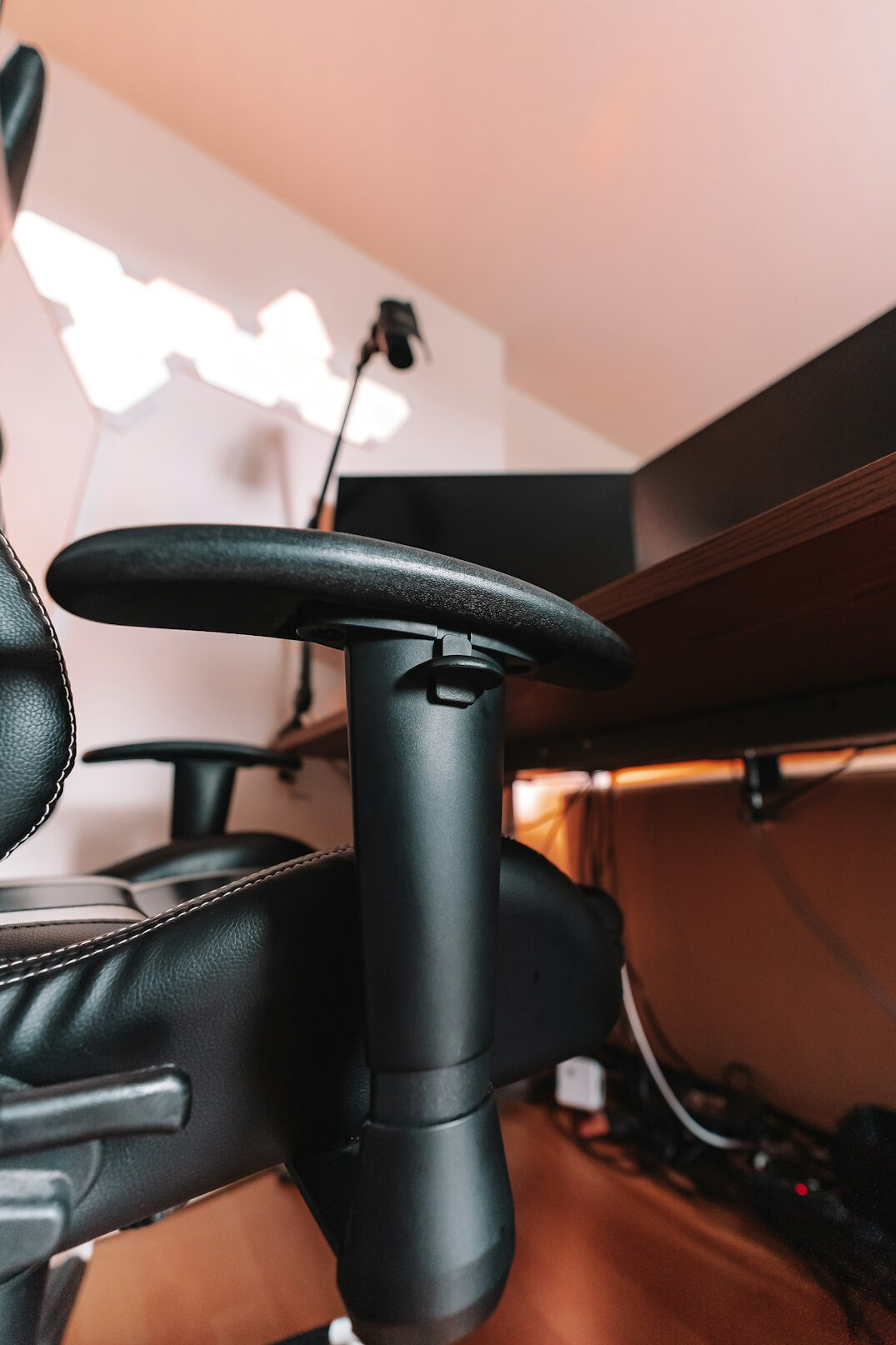 Specialist adjusting a monitor height at an employee desk