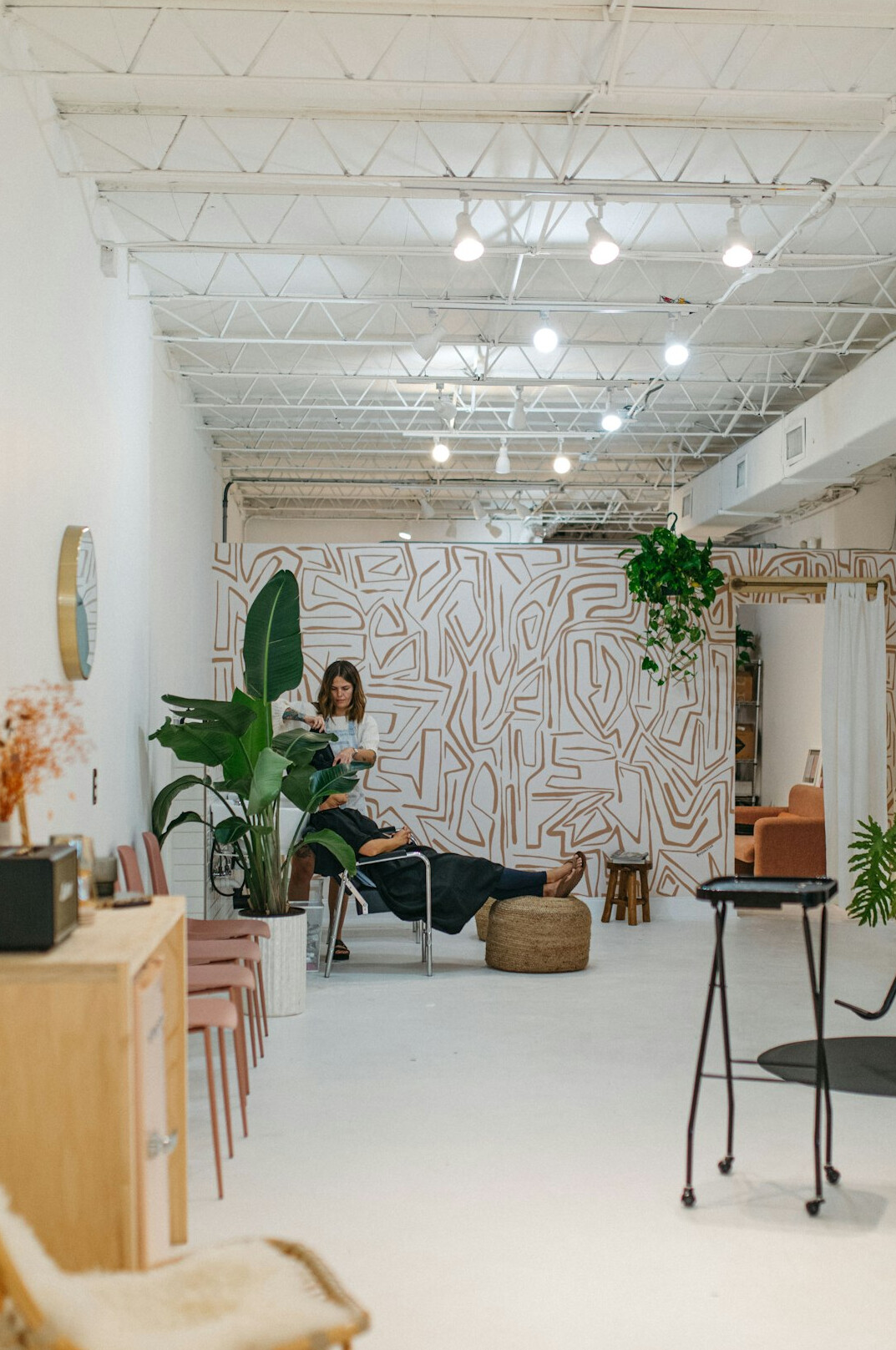 Smiling woman wellness coach leading a session in a bright modern office