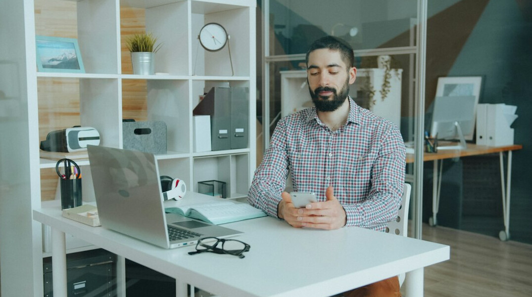 person meditating at desk